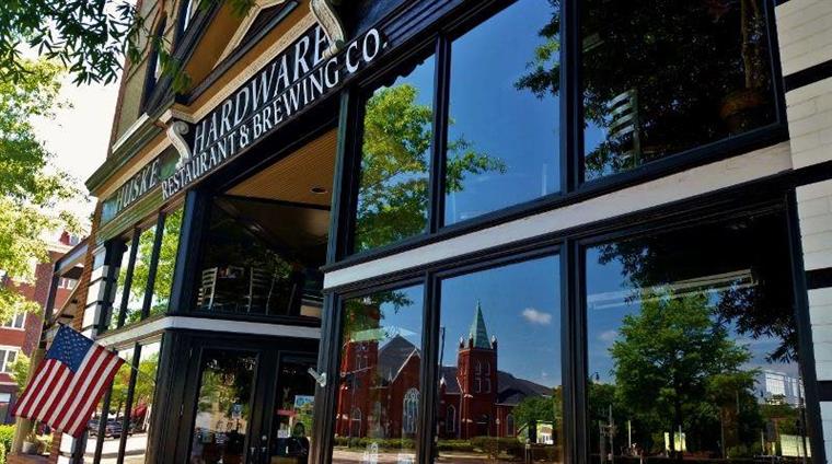 front windows and door of Huske Hardware Restaurant & Brewery